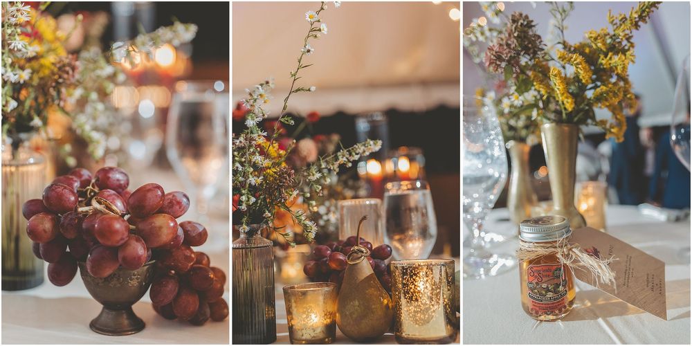 Rustic fall wedding reception table settings with candles, autumn leaves, and warm floral arrangements in muted tones.