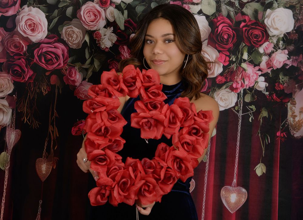A collage of red and pink roses with floral arrangements against a dark background.
