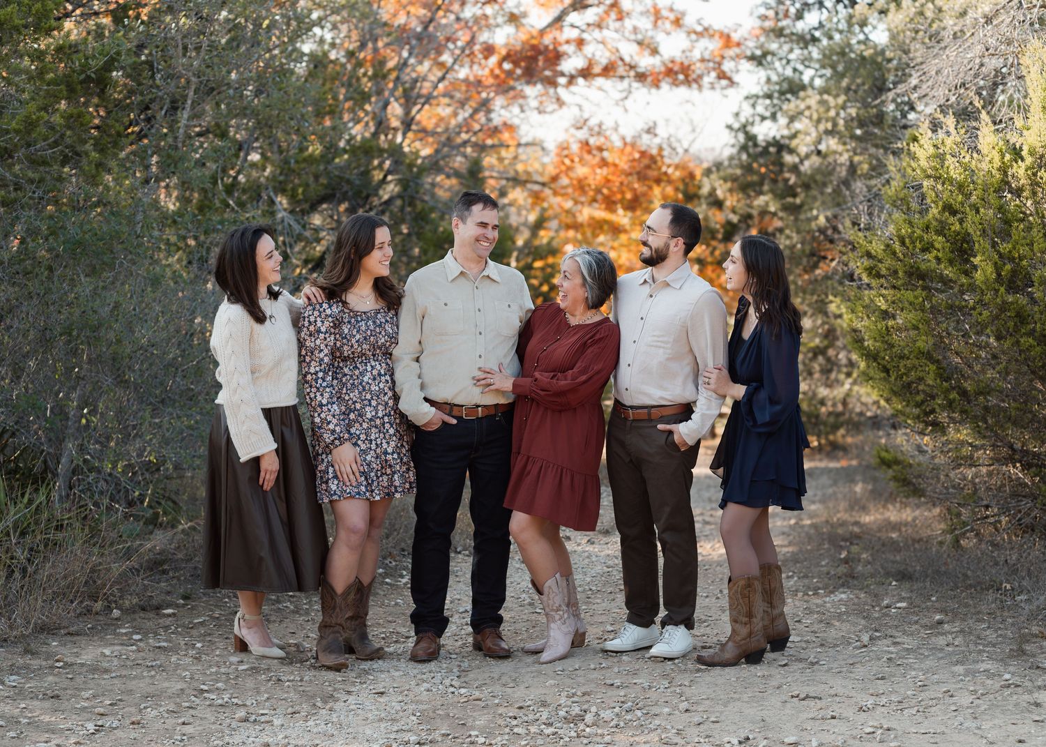 Extended family laughing together during session at McKinney Falls State Park in Texas
