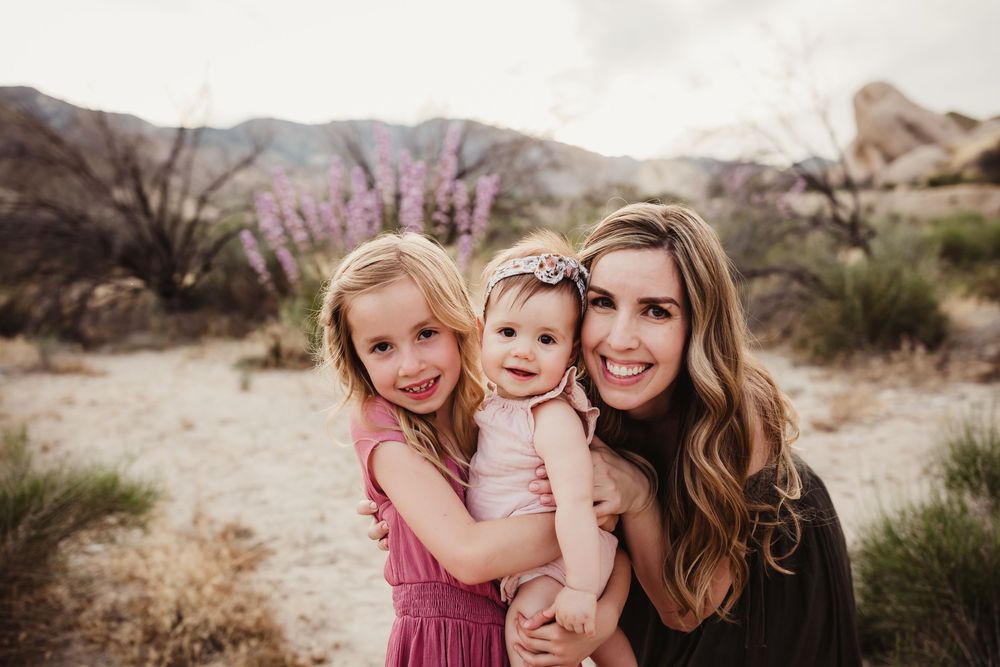 Beautiful desert photoshoot featuring loving family interactions at golden hour.