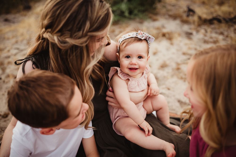 A series of candid outdoor family photos showing joyful interactions between loved ones in a natural setting.