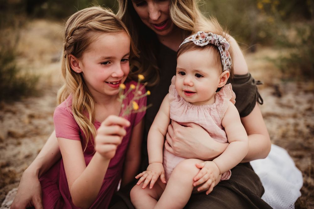 Heartwarming candid family moments captured against rugged desert scenery.