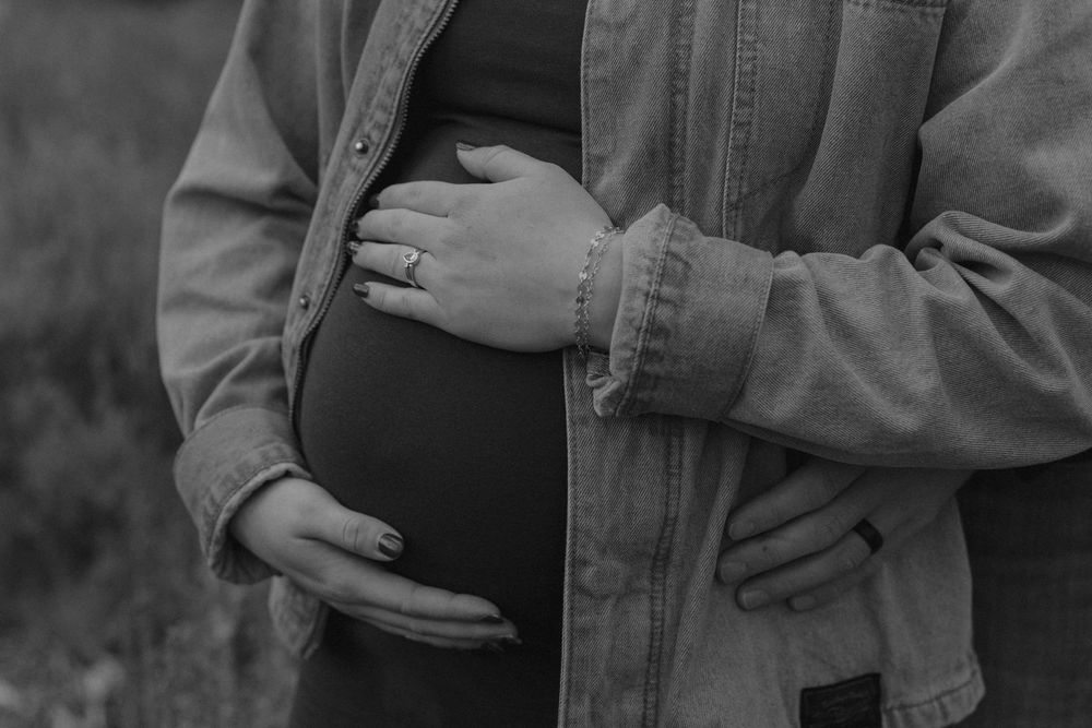 Close-up shots of hands and embraces in casual denim clothing outdoors.
