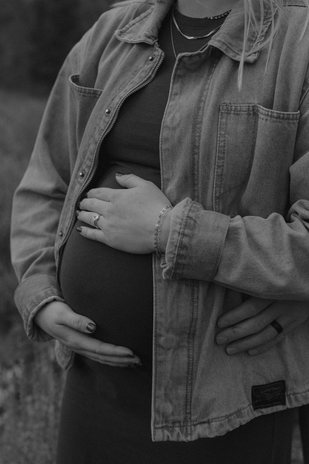 Close-up shots of a person wearing a denim jacket showing their midsection.