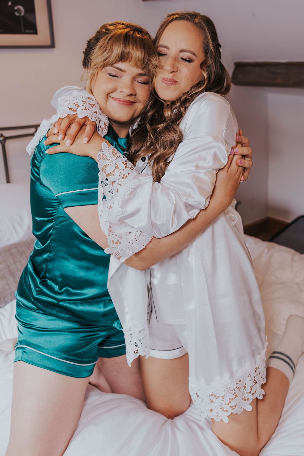 A series of intimate photos showing two people embracing, one wearing a teal top and one in white lace.
