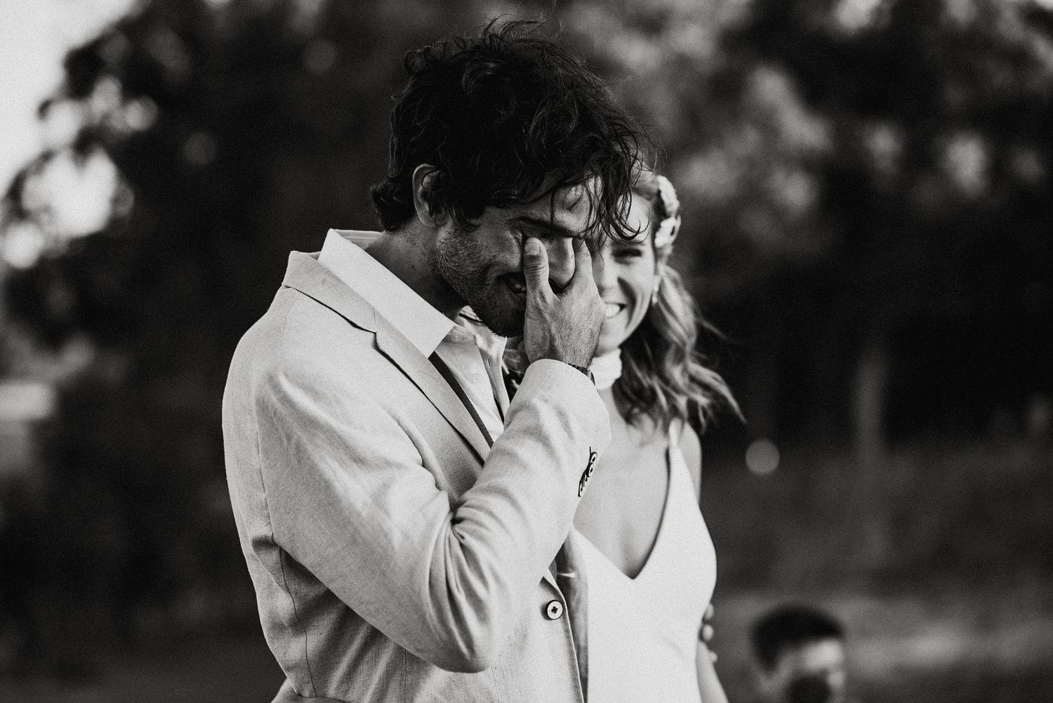 Intimate black and white portrait of couple during emotional moment.