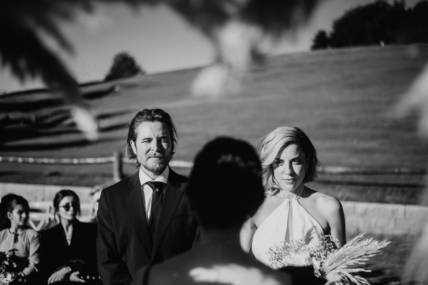 Patagonia destination wedding at Llao Llao Resort. Newlyweds posing with the Andes Mountains backdrop during golden hour