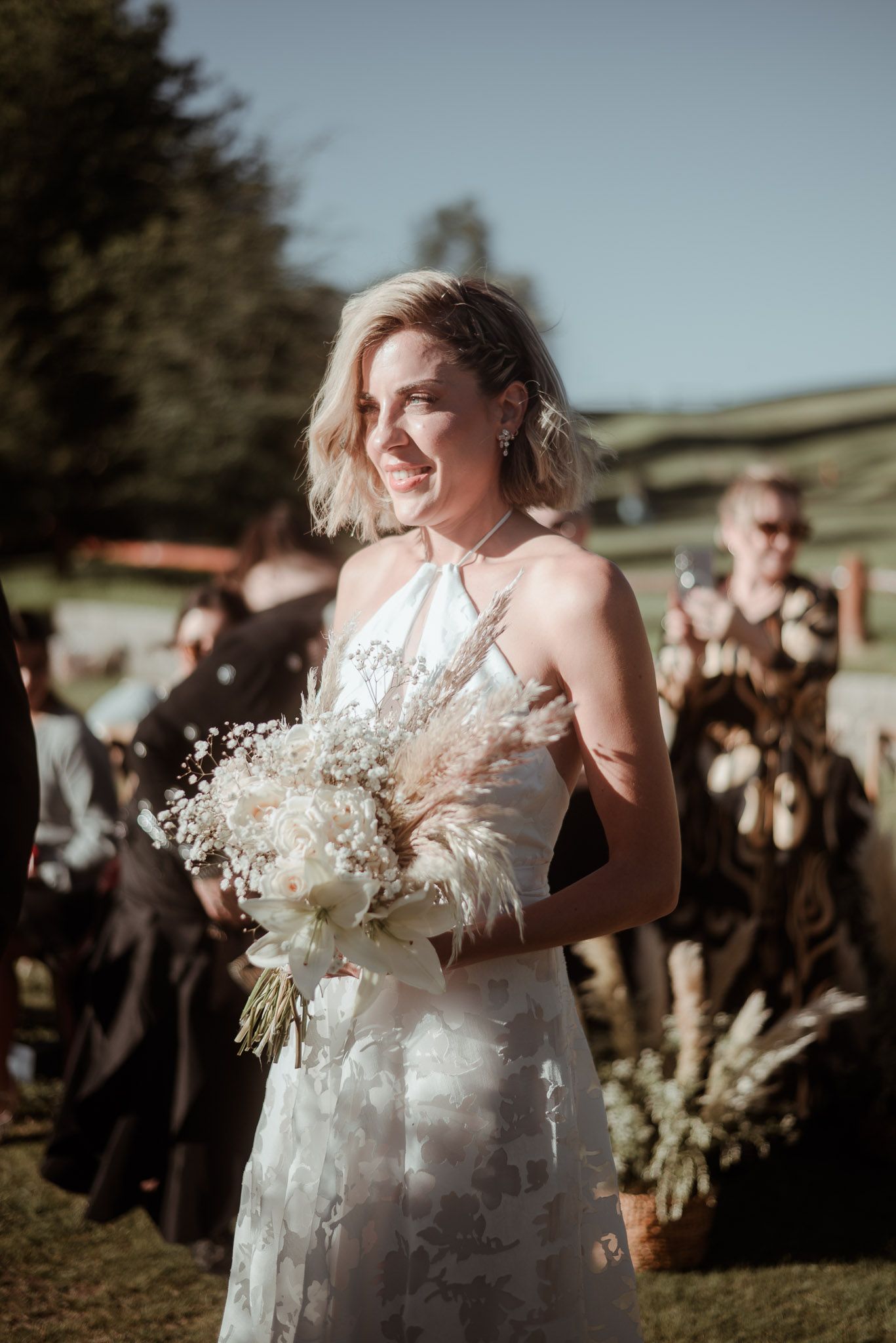 Sophisticated bridal shoot by the Nahuel Huapi shoreline. Art-inspired wedding photography featuring lakefront luxury and refined aesthetics