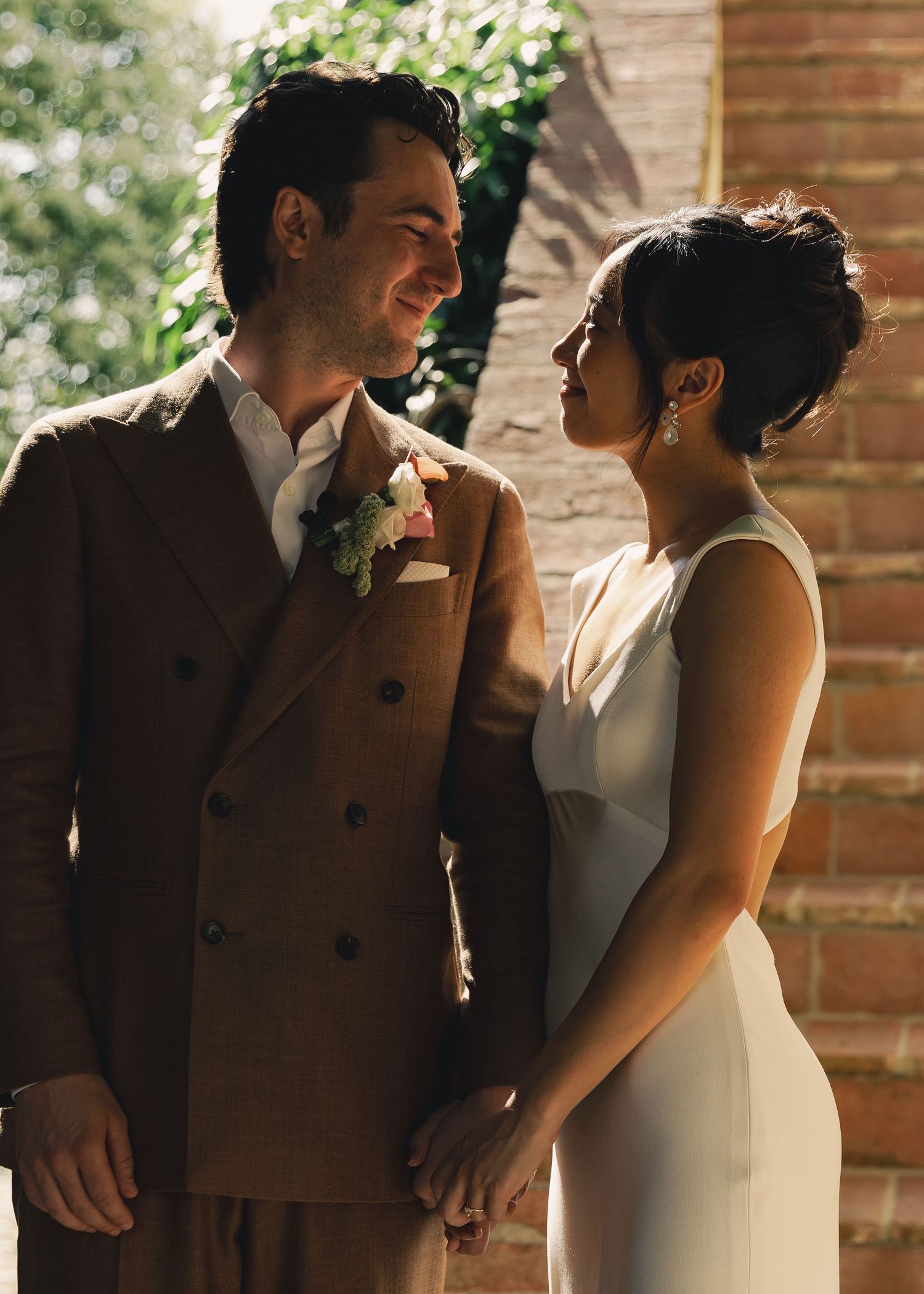 Romantic black and white portrait at stone steps with vintage street lamp.
