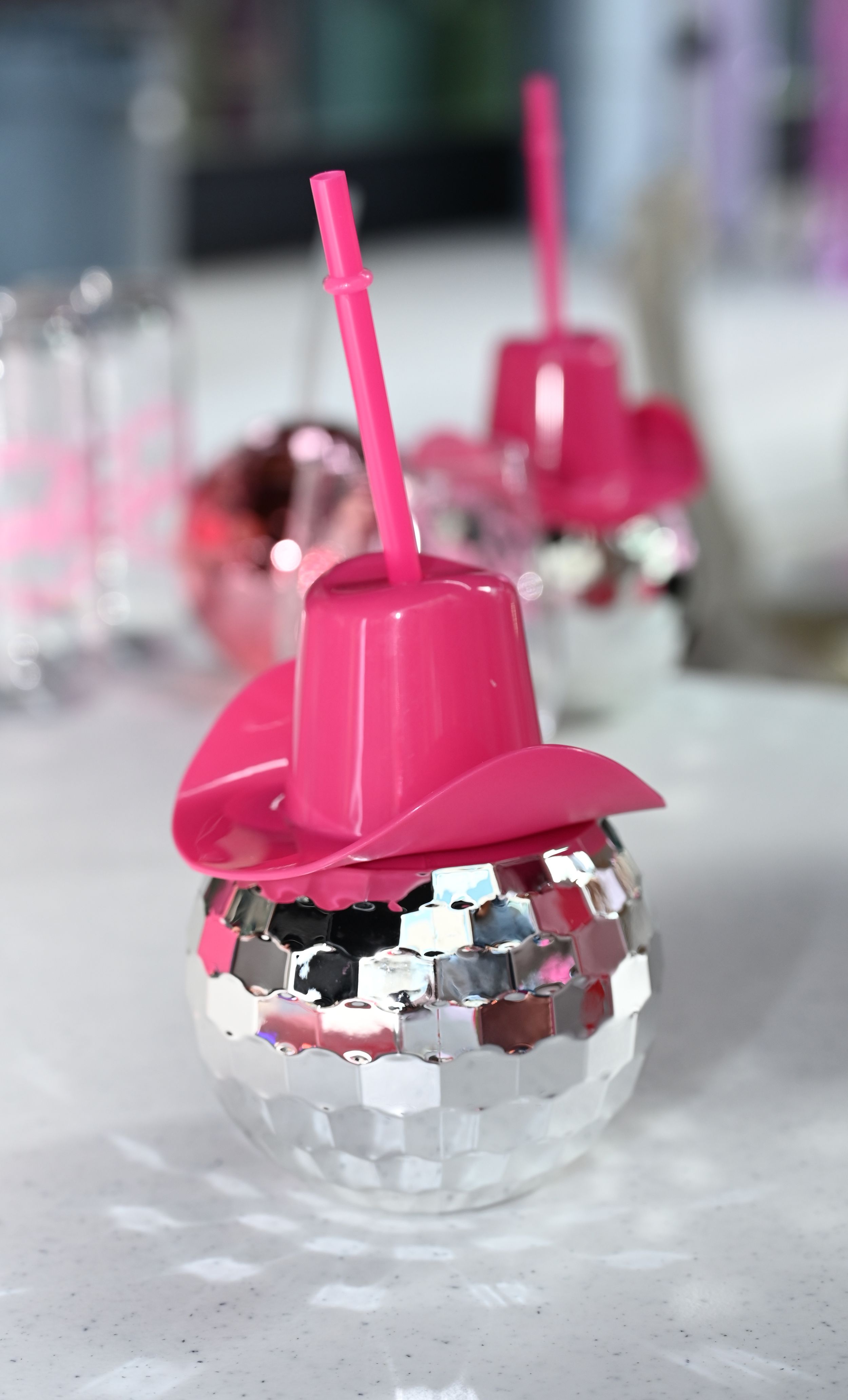Mini Disco balls with pink cowboy hats.