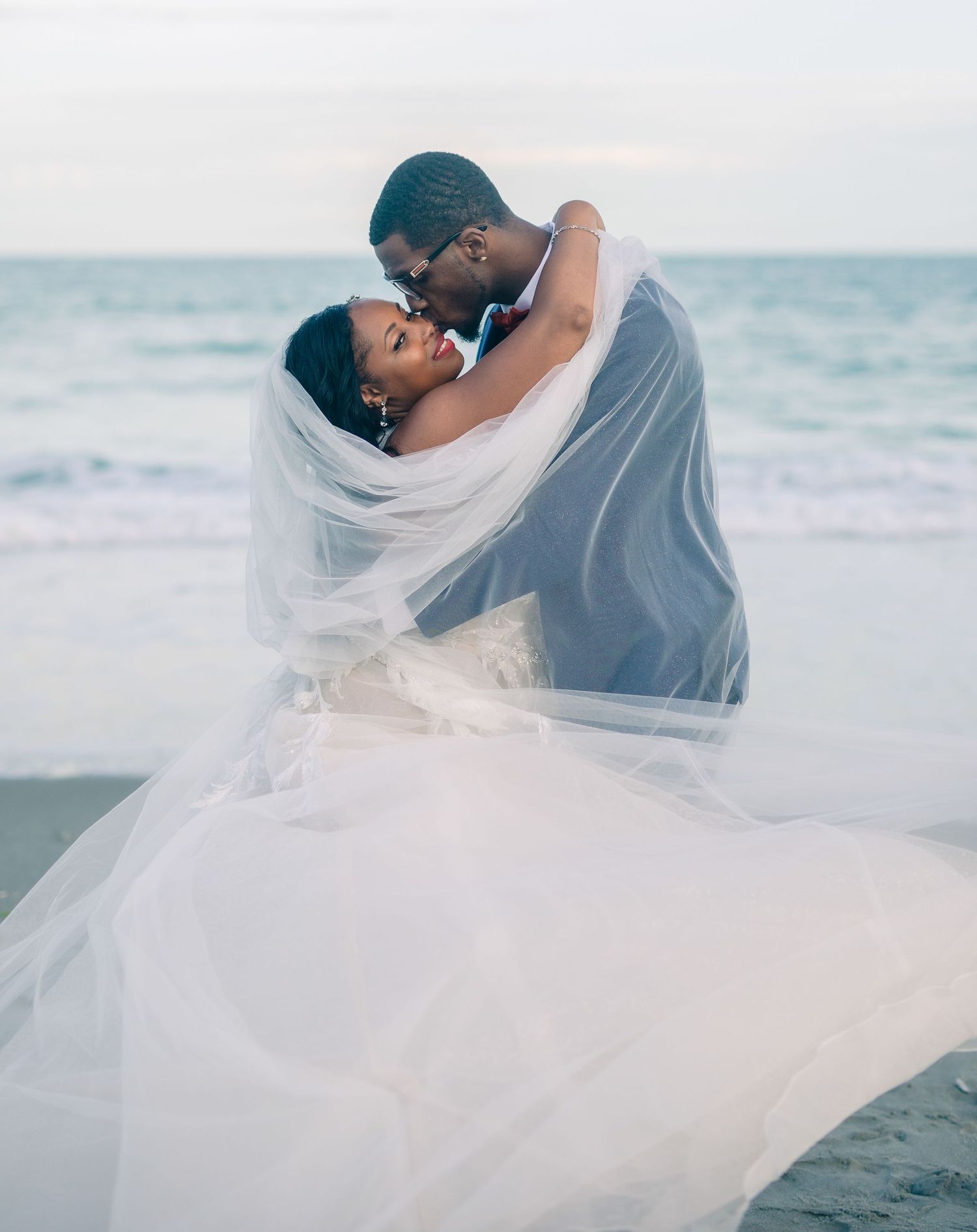 Outdoor wedding portrait on the Beach, photographed by a Windsor-based professional, Tasha Cannaday, serving Essex-County.
