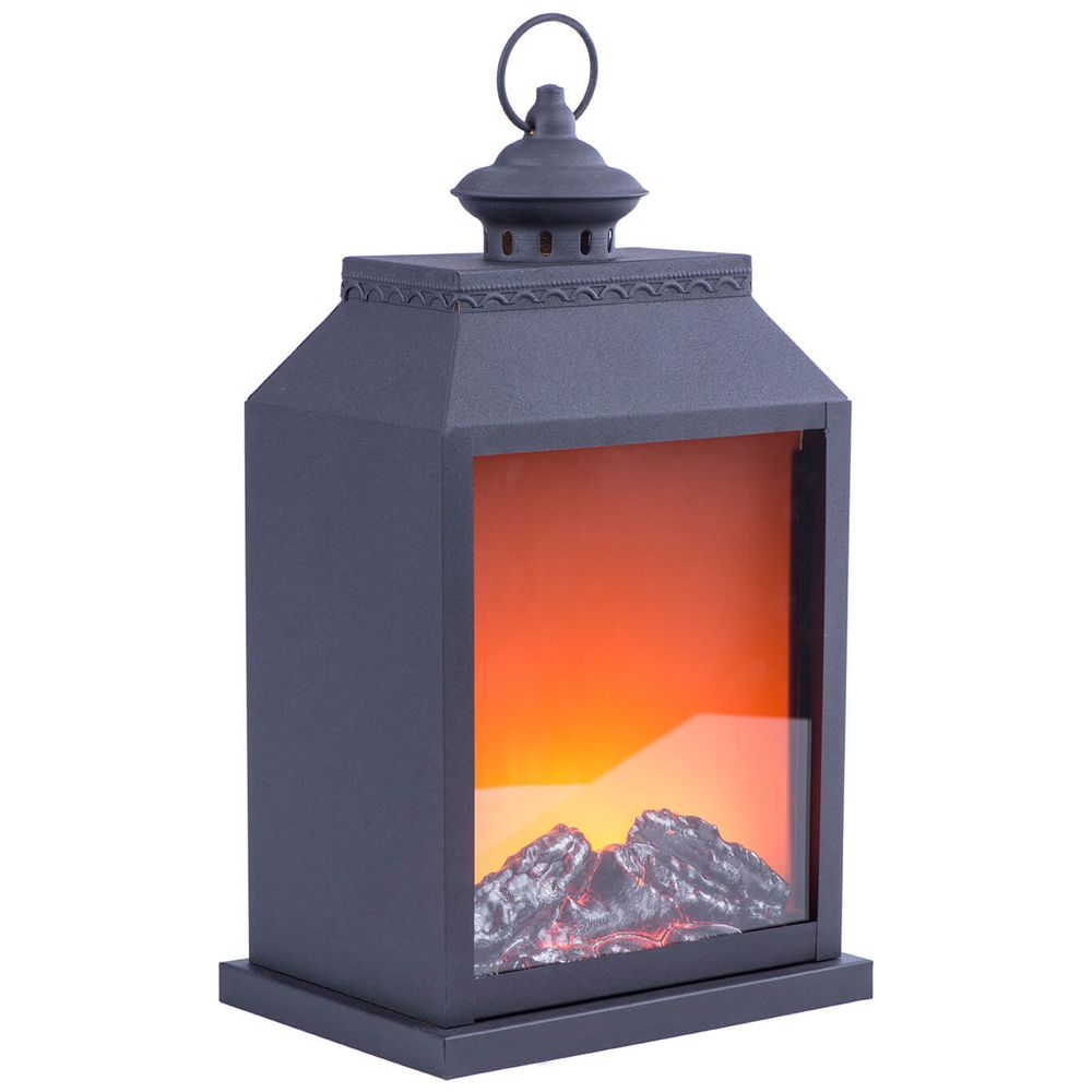Black decorative lantern with LED fireplace effect displaying mountain scenery and orange glow.