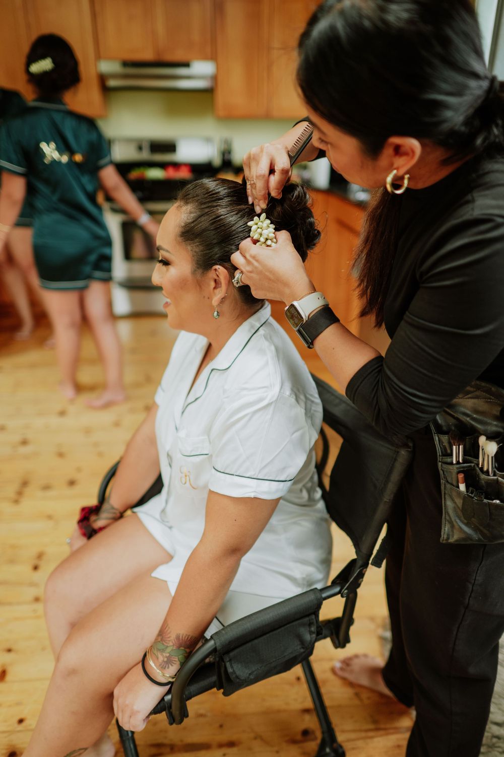 Wedding day hair styling preparation in progress.