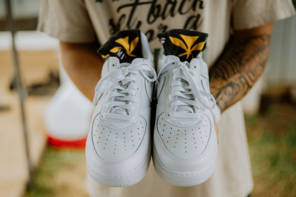 White sneakers and casual footwear arranged for wedding day photography.