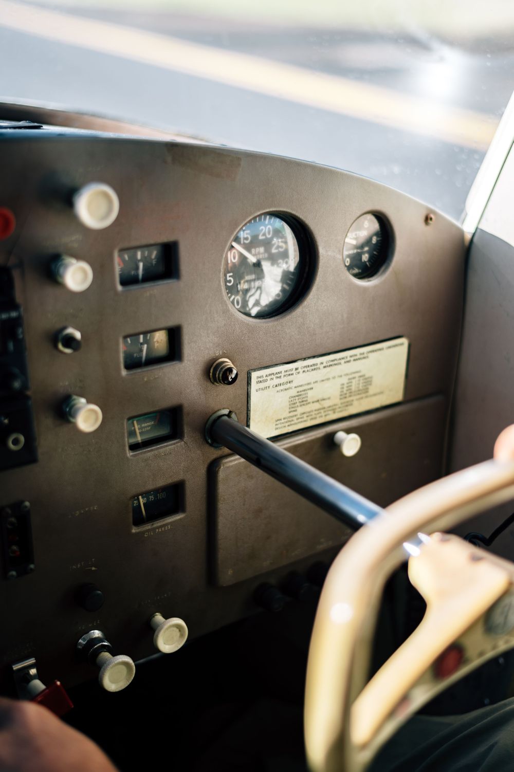 Aircraft instrument panel showing gauges and controls in cockpit.