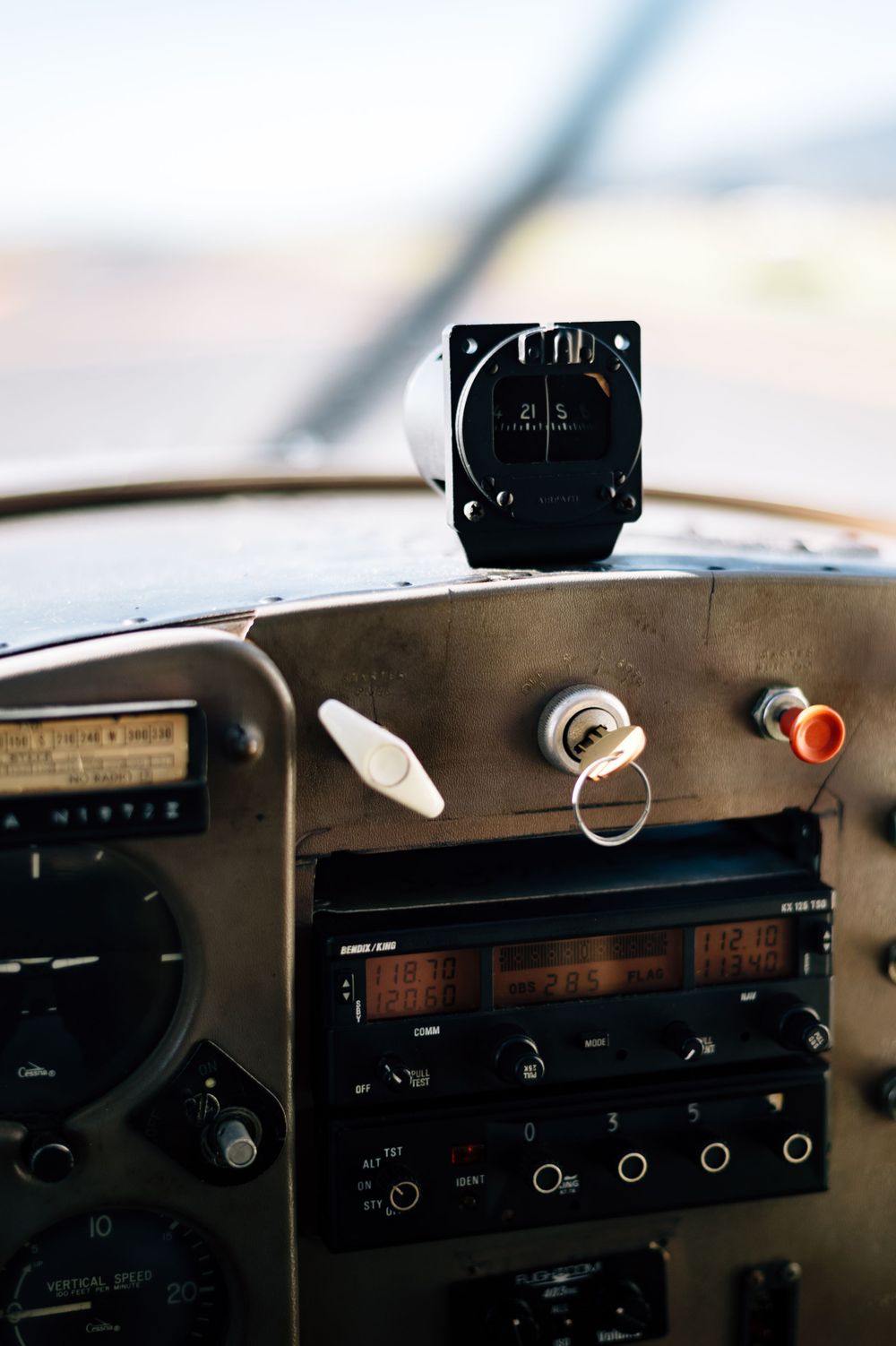 Vintage aircraft radio and navigation equipment mounted in cockpit dashboard.