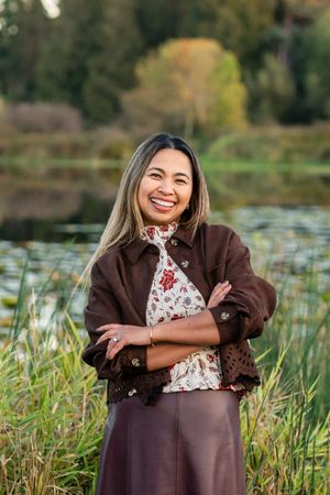 Woman smiling for photo at a park in Bellevue.
