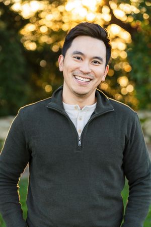 Man smiling for a photo at a park in Kirkland.