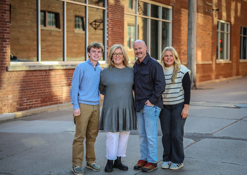 Group photos against a brick building exterior in natural lighting.