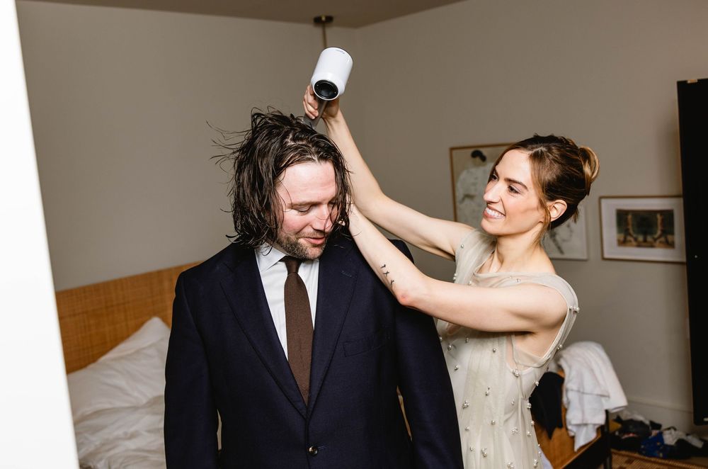 A wedding couple shares an intimate moment in formal attire. Pizzeria Beddia Wedding. Fishtown Philadelphia, PA.