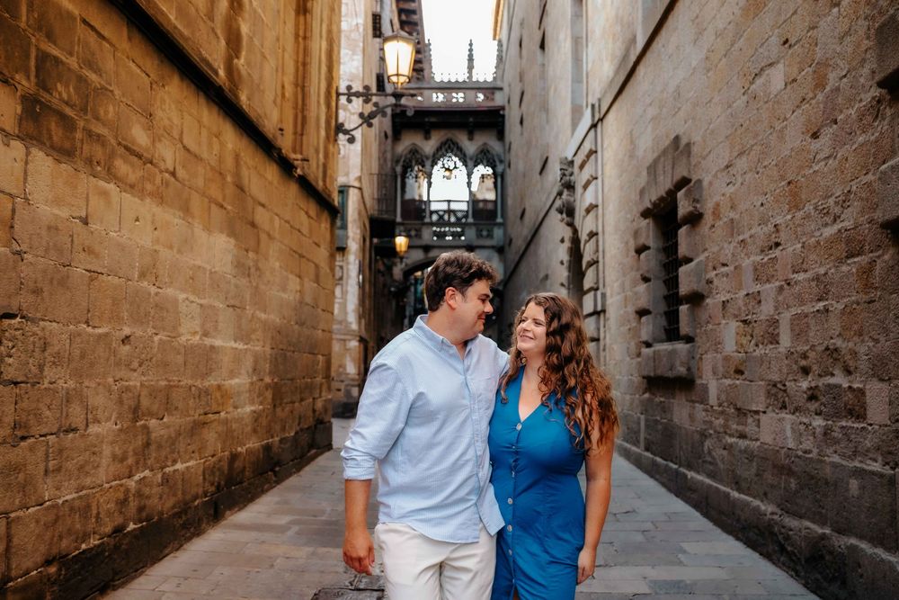 Couple walking in Old City Barcelona