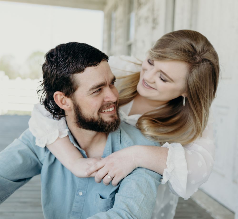 Intimate moments captured in soft lighting with casual denim and light-colored clothing.
