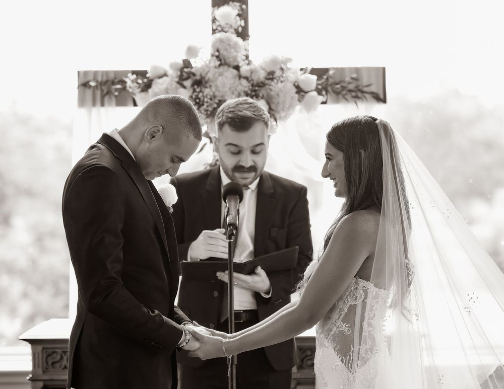A series of black and white wedding photographs showing emotional moments during the ceremony and ring exchange.