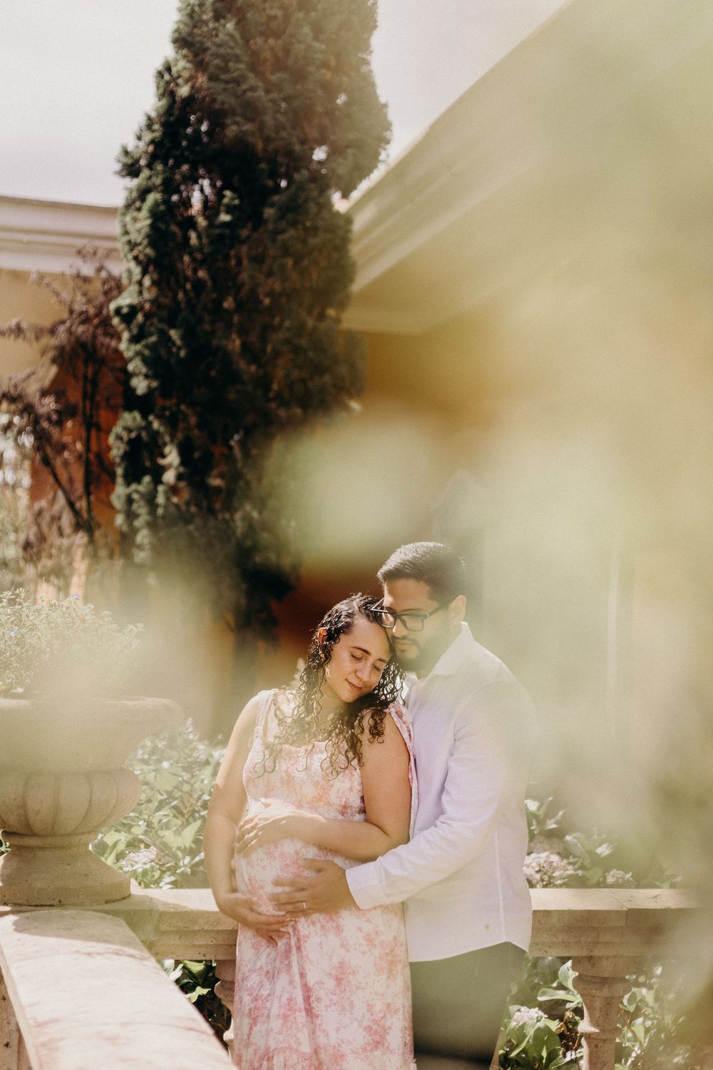 Romantic garden photoshoot with dreamy, soft-focus effect among blooming flowers.