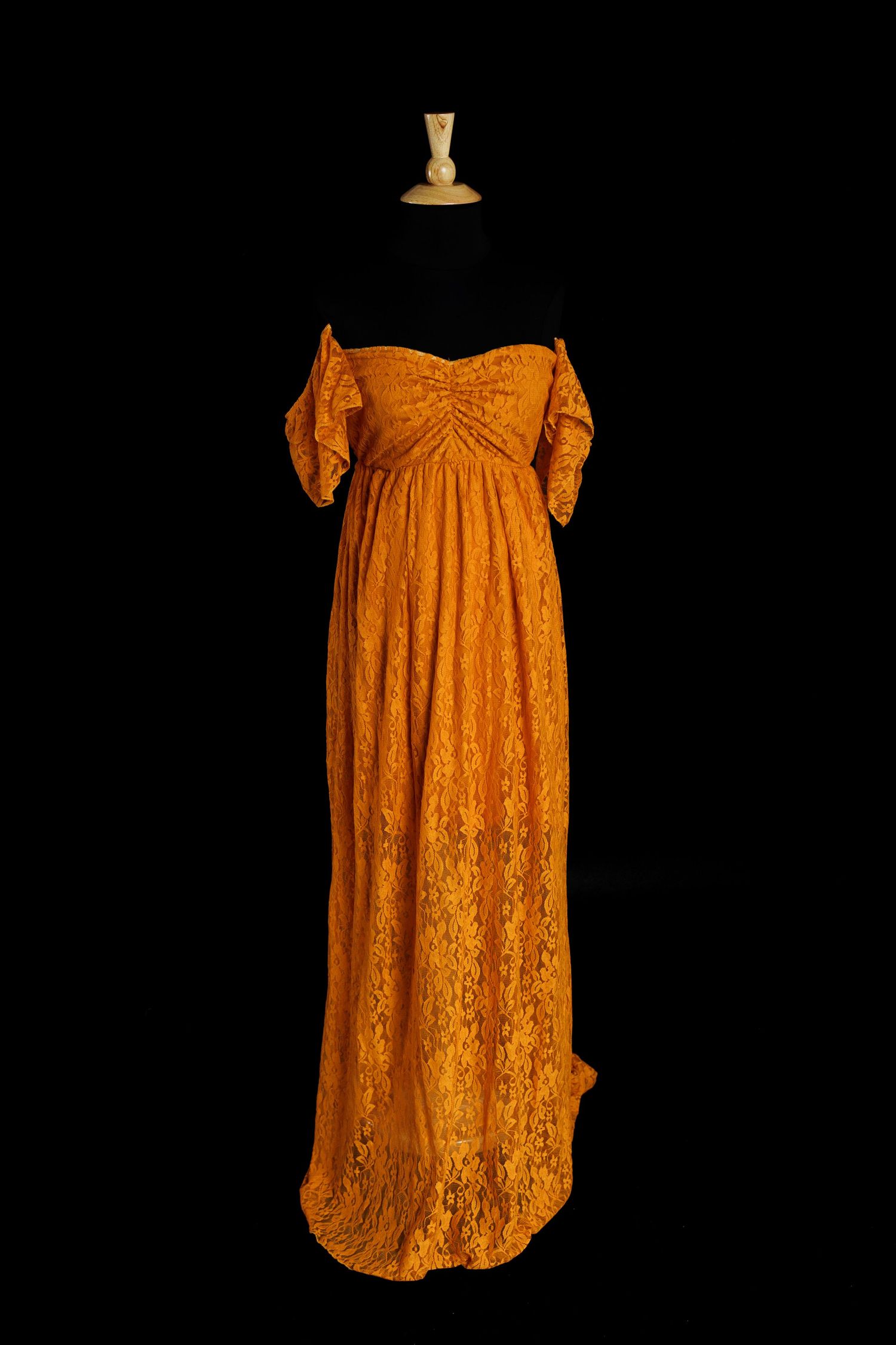 Flowy beige dress with empire waist and short kimono sleeves displayed on black background from multiple angles.