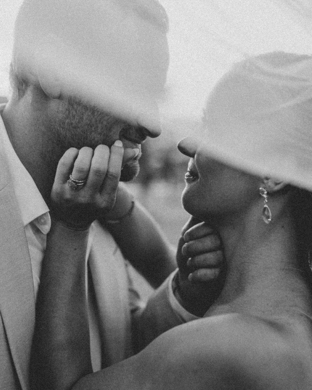 Black and white photo of three people covering their faces with their hands in a synchronized pose.
Kima Tulum wedding photographer