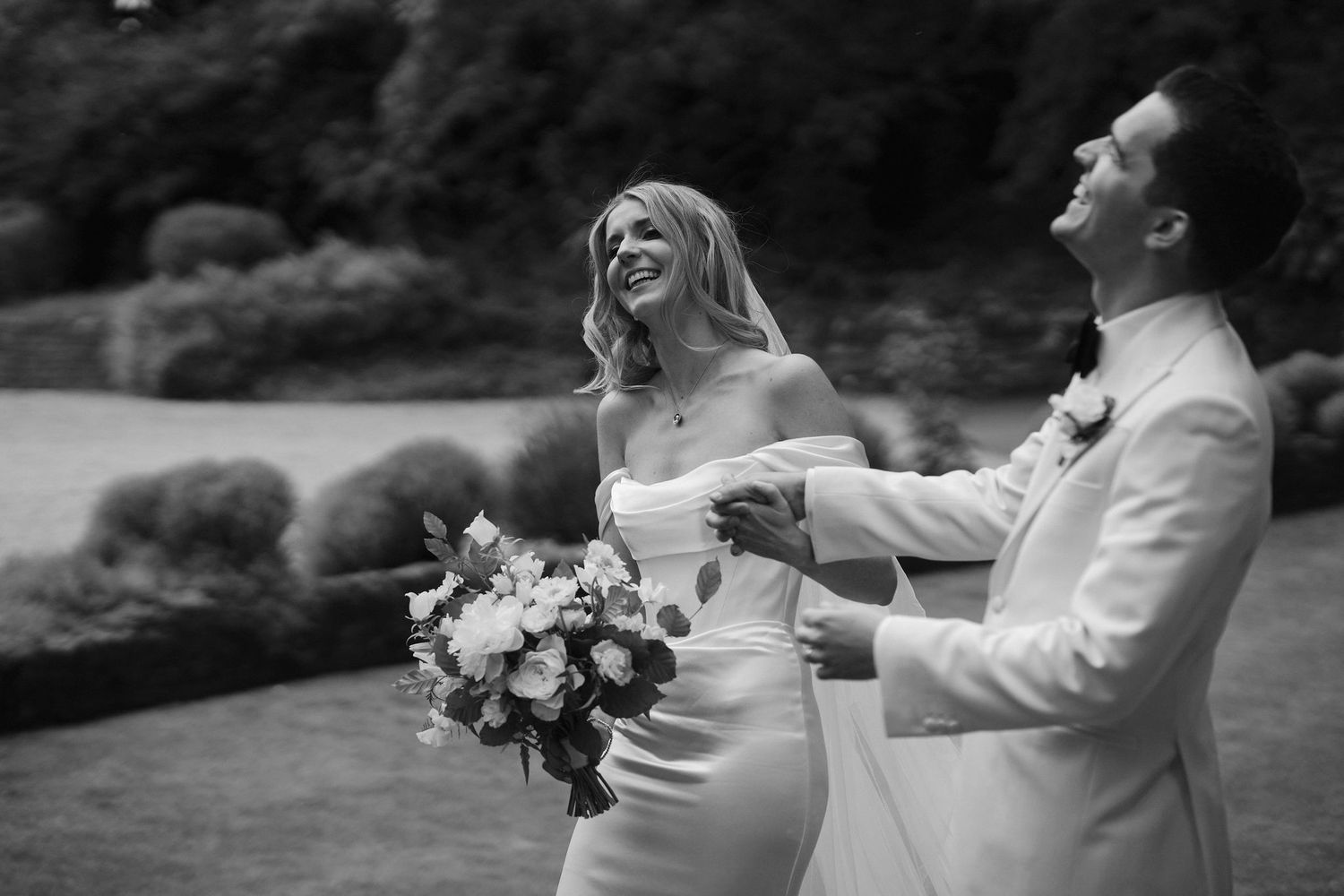 bride and groom laughing at Hamswell house in bath