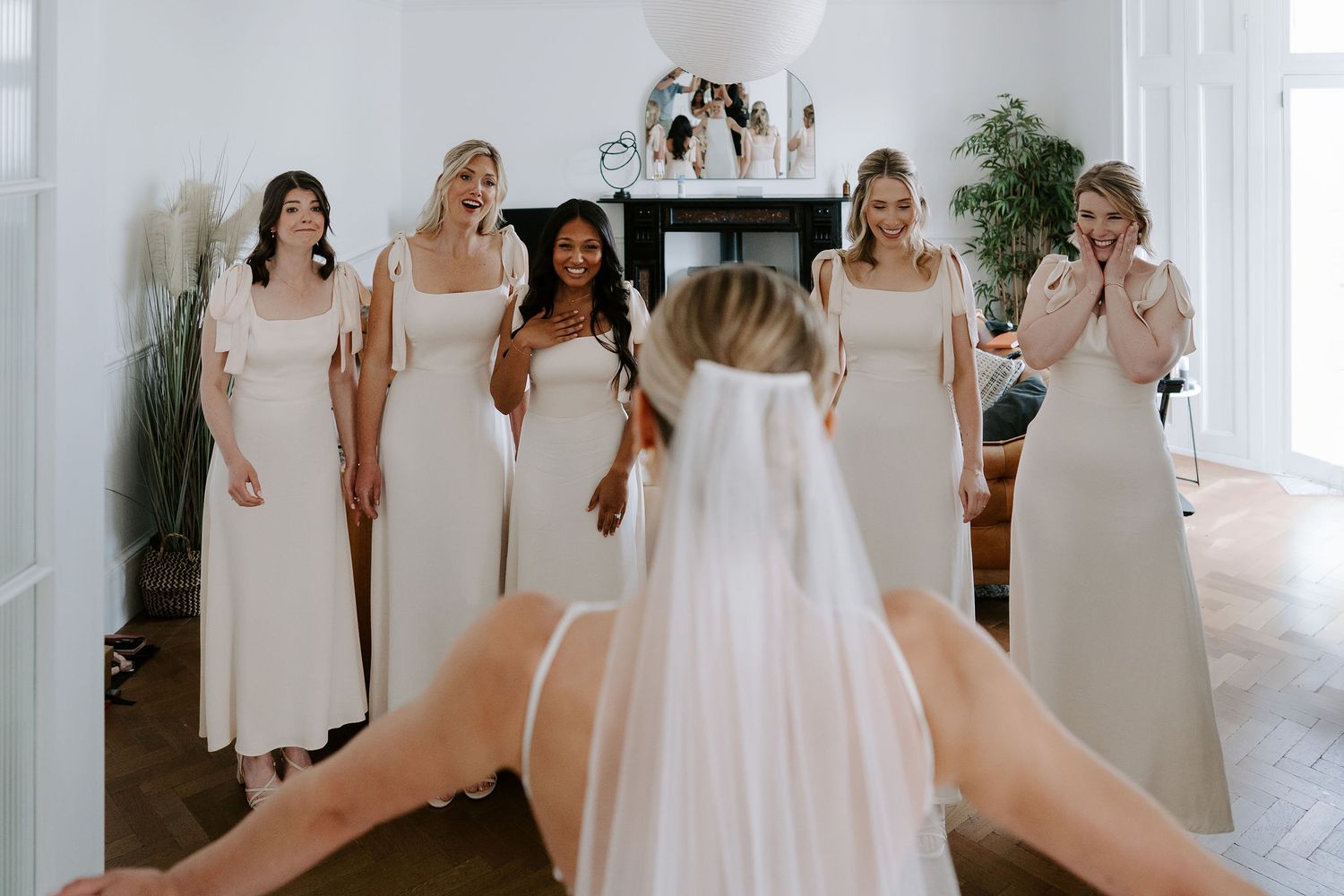 Tunnels Beach Wedding Venue in North Devon, Bride first look with bridesmaids