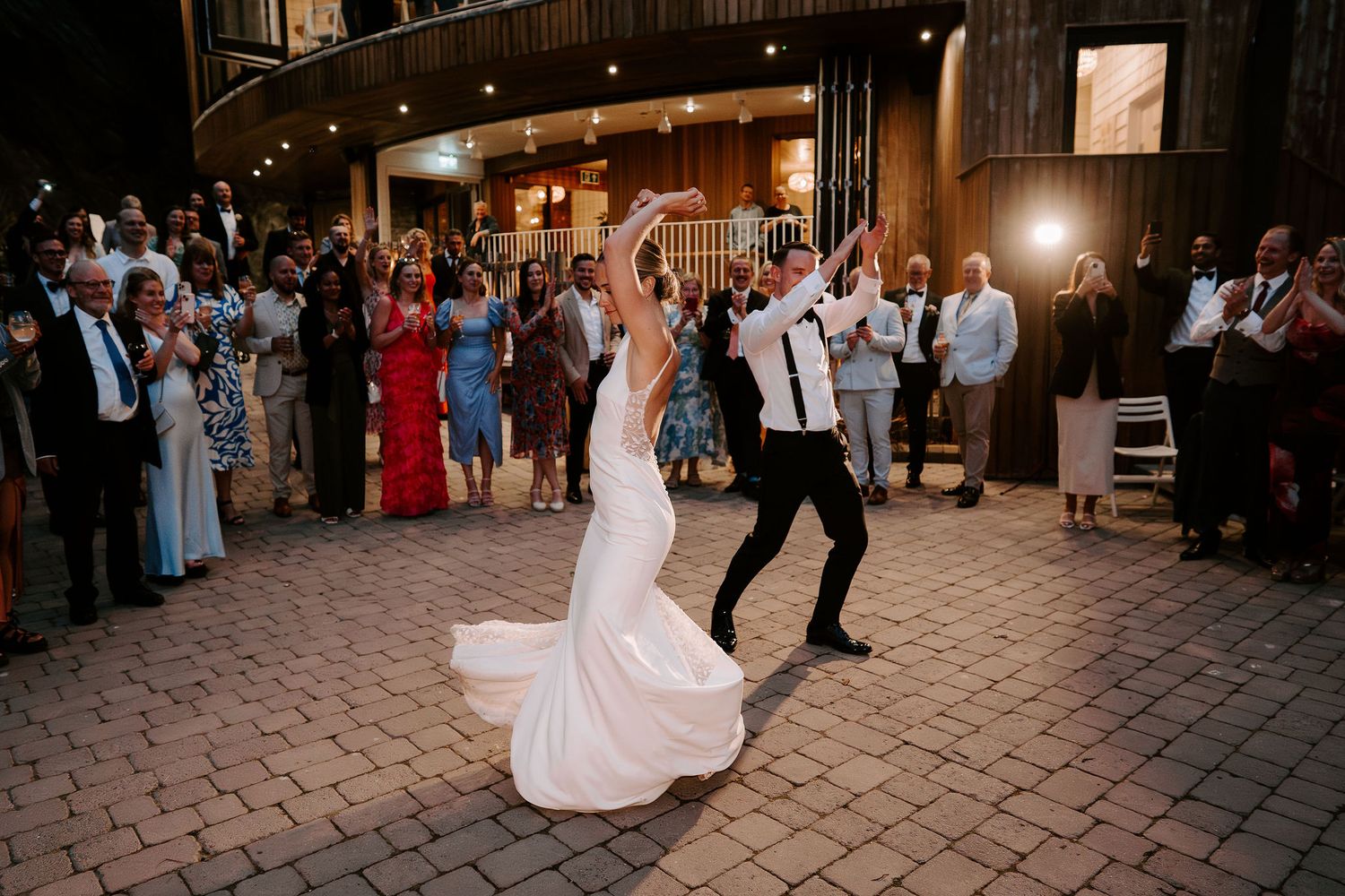 bride and groom dancing outside at tunnels beach wedding venue in north Devon