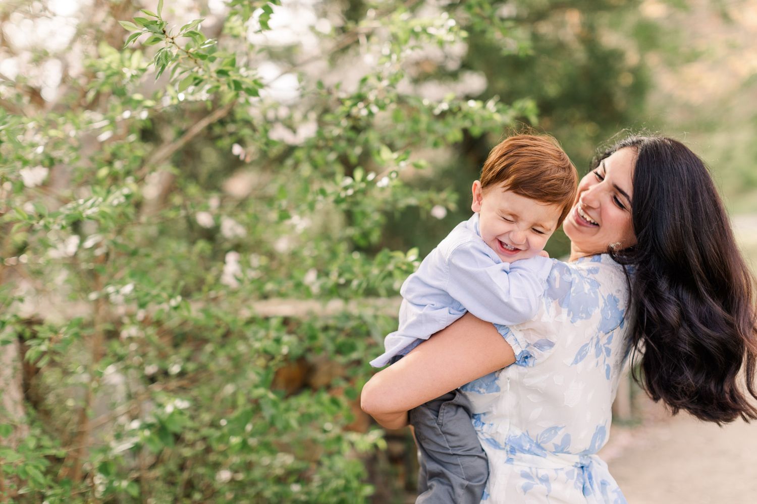 Mom with toddler son for a Cherry blossom mini sessions in Richmond Virginia.