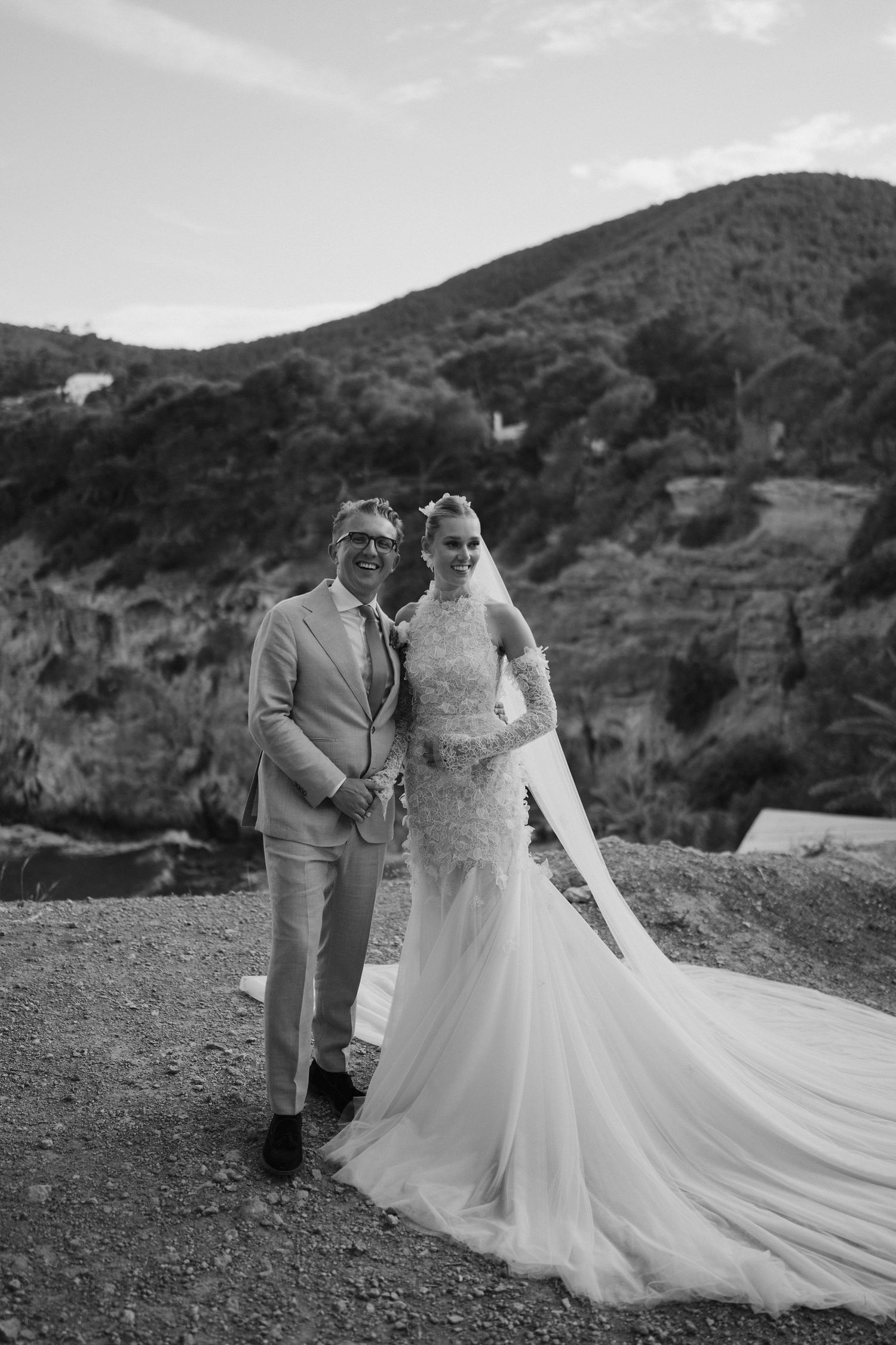 bride and groom laughing on cliffs at amante ibiza