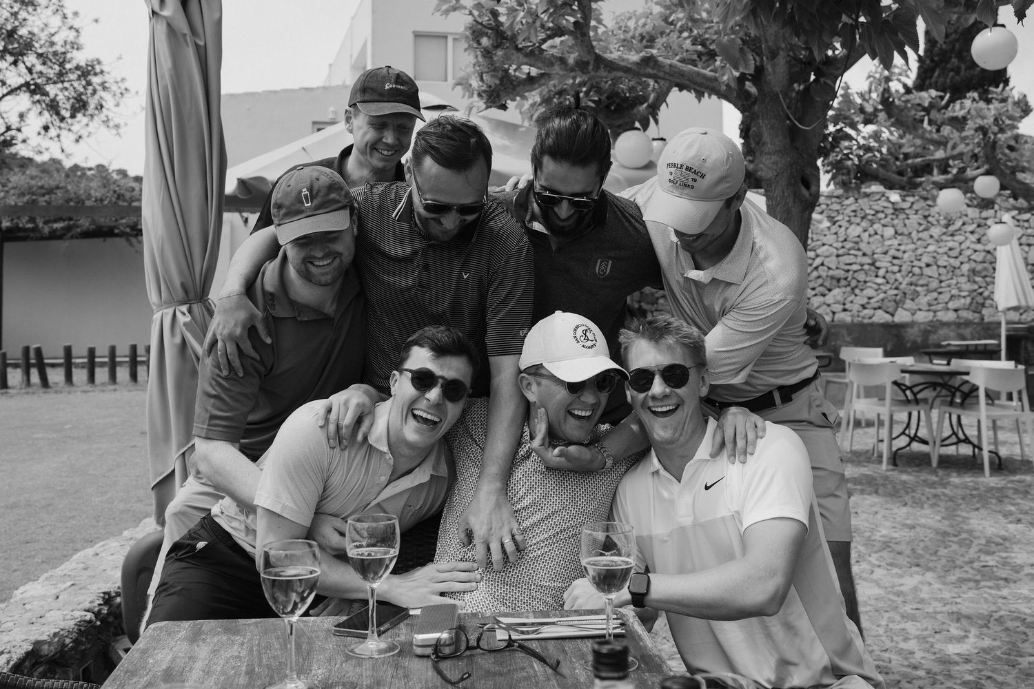 groom and groomsmen having drinks after golf at golf ibiza