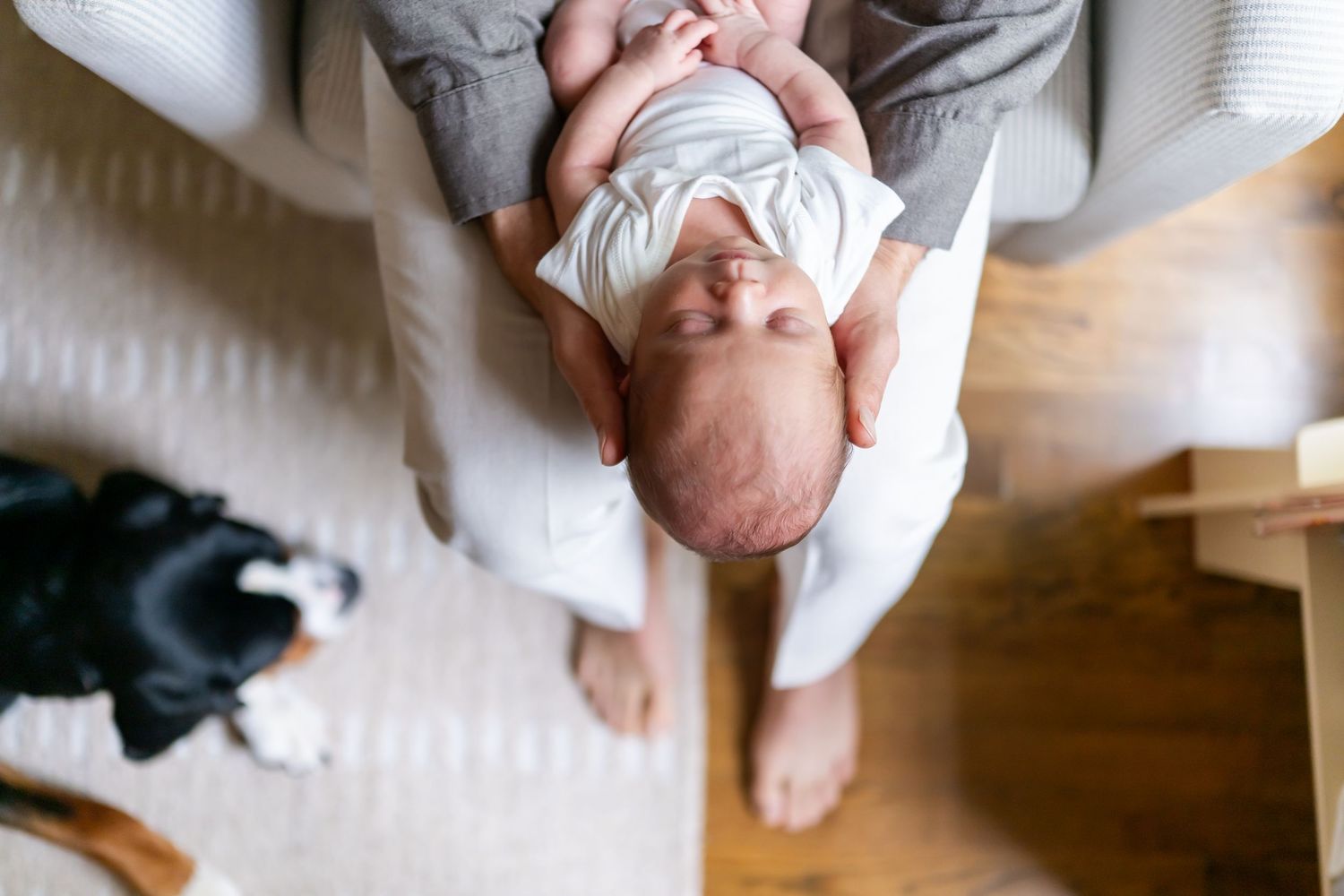 A sequence of six photos showing a baby rolling over on a soft blue blanket.