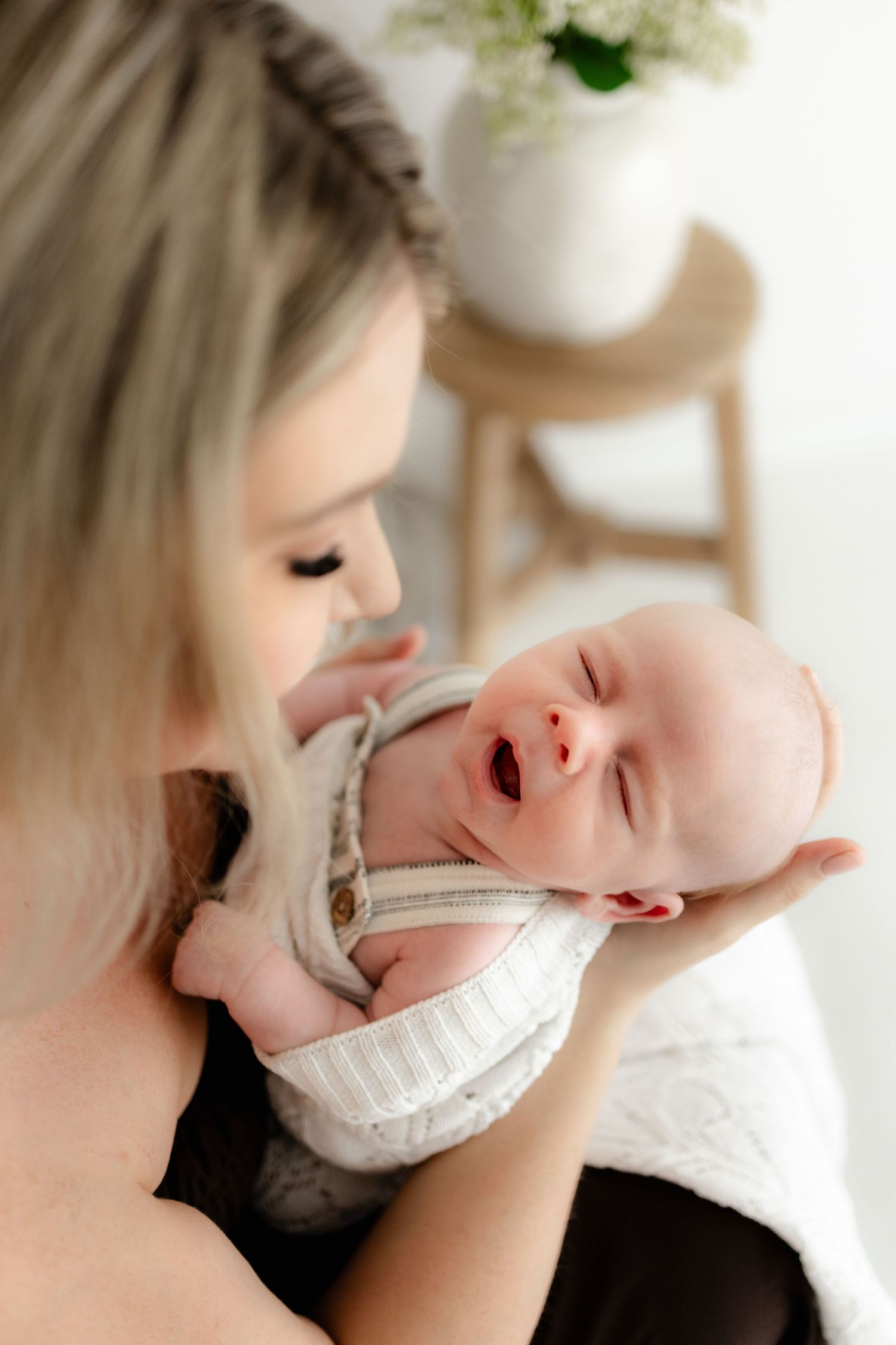 Close-up sequence of a baby's expressions and movements showing various emotional reactions.