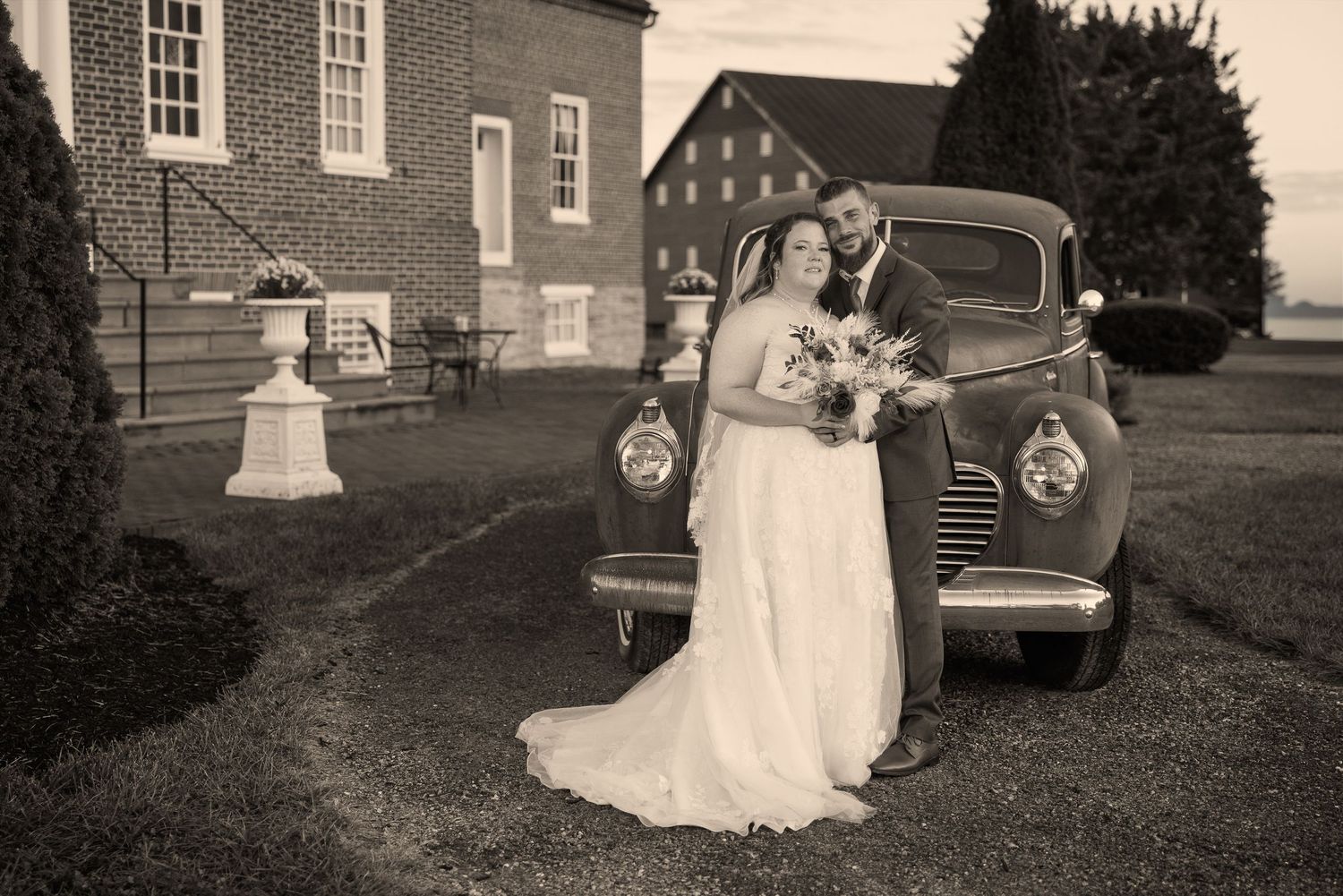 frederick maryland wedding photographer Black and white wedding portraits with vintage automobile and historic building.