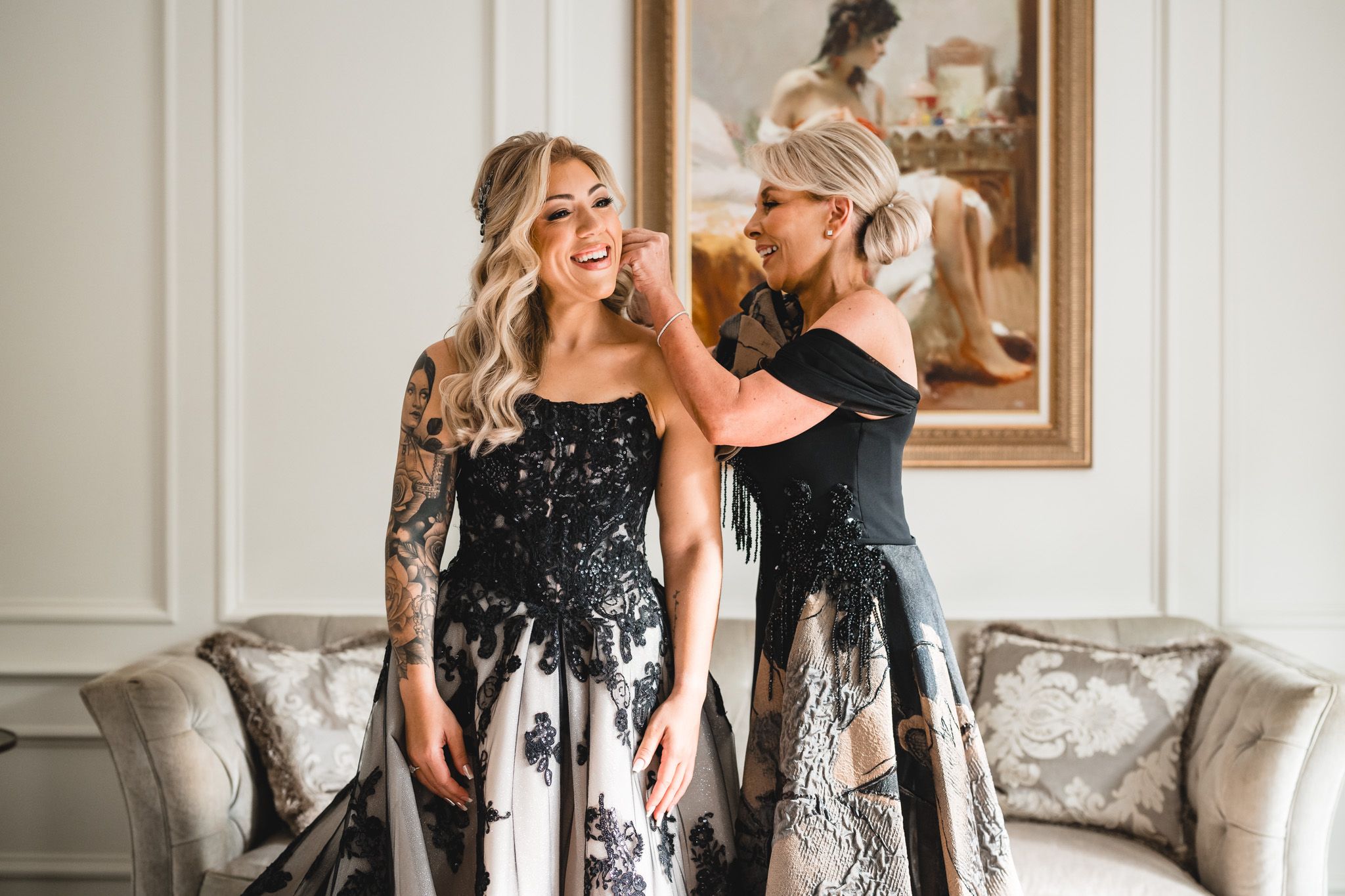 Candid moments of wedding party celebrating and laughing together in an elegant room.