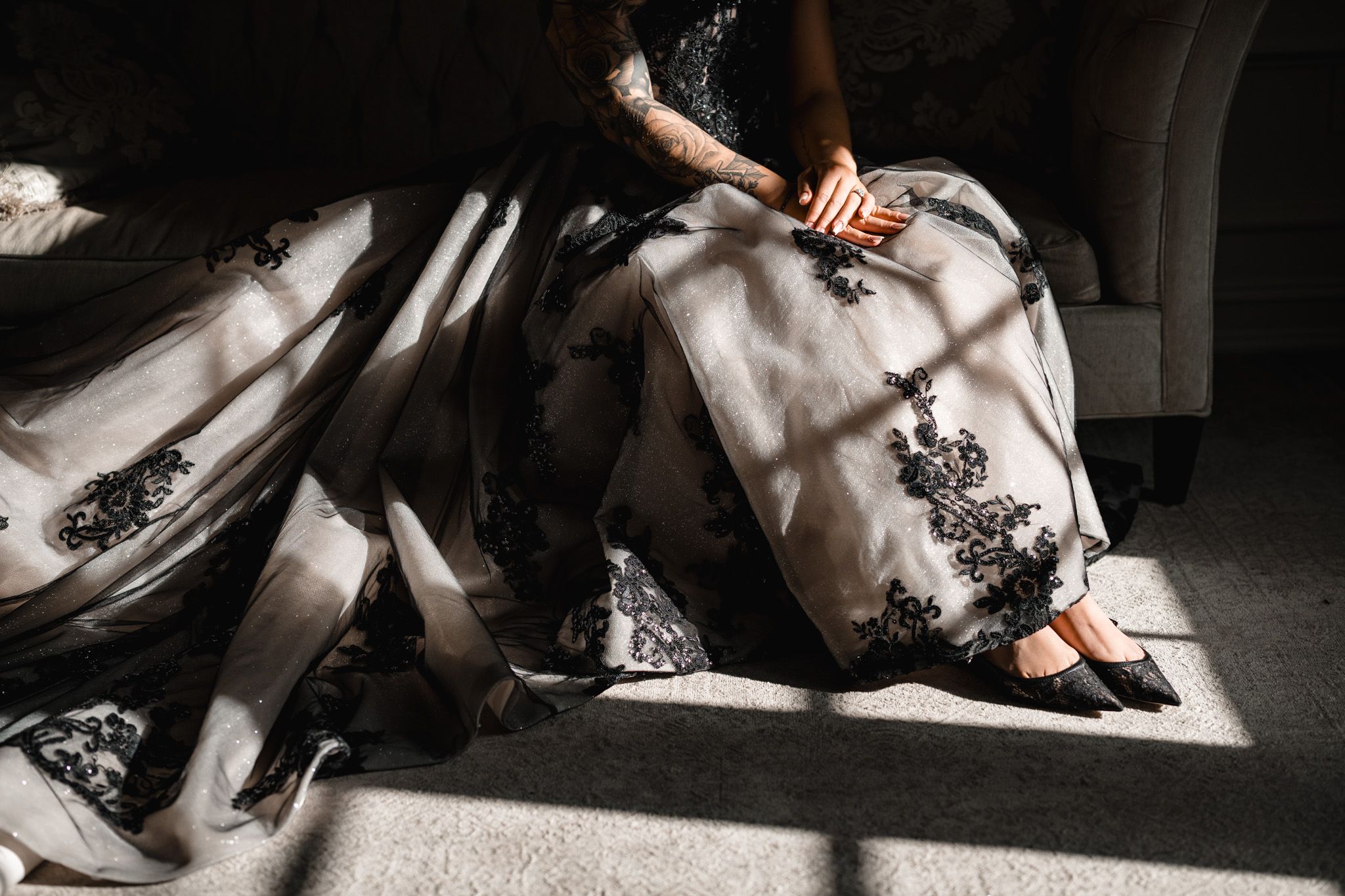 Dramatic low-angle black and white photos of wedding party on the floor.