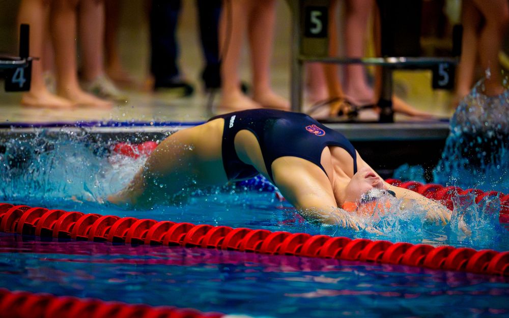 Hershey swimmer in orange cap preparing to start a backstroke race at the Keystone swim meet.
