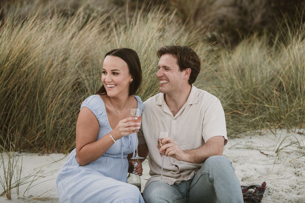 Couples session with their dog at Big Roaring Beach in Southern Tasmania, captured by elopement and family photographer Joss Jensen