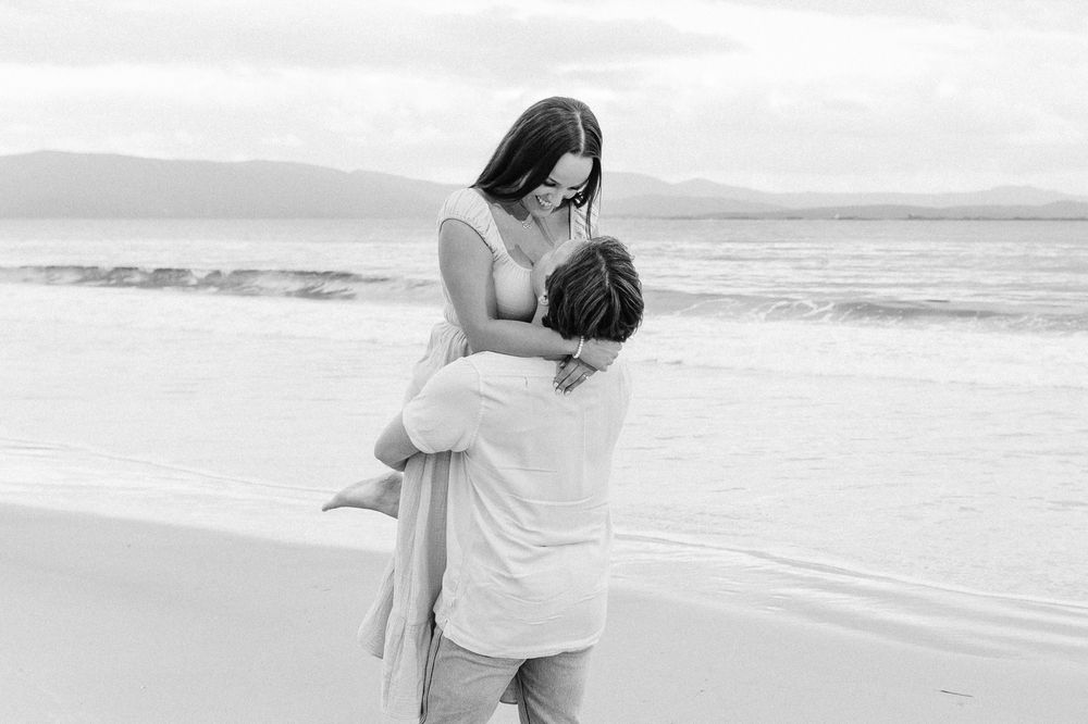 Couples session with their dog at Big Roaring Beach in Southern Tasmania, captured by elopement and family photographer Joss Jensen