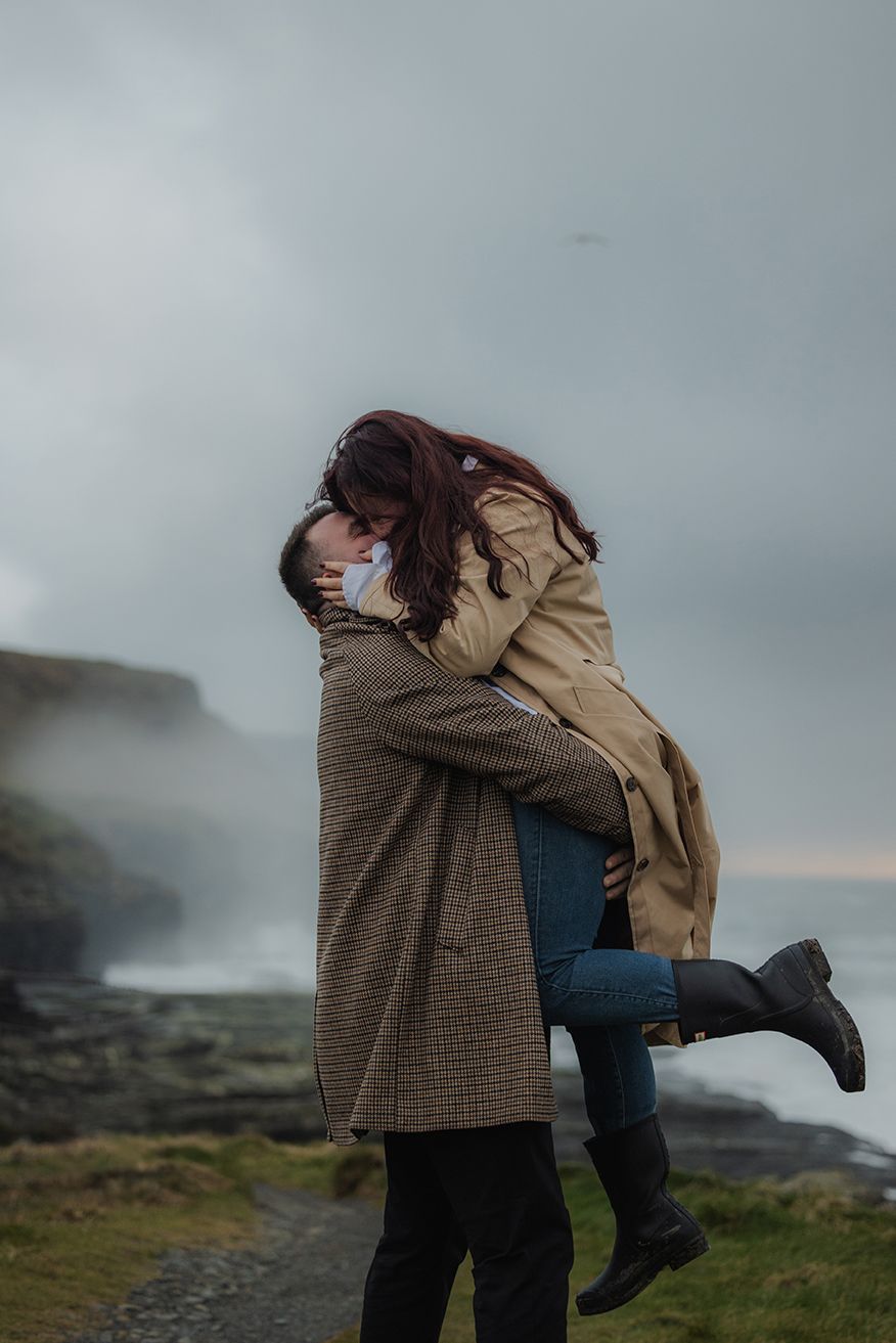 Wild Atlantic Way engagement portraits during sunset storm at Doolin Cliff Walk