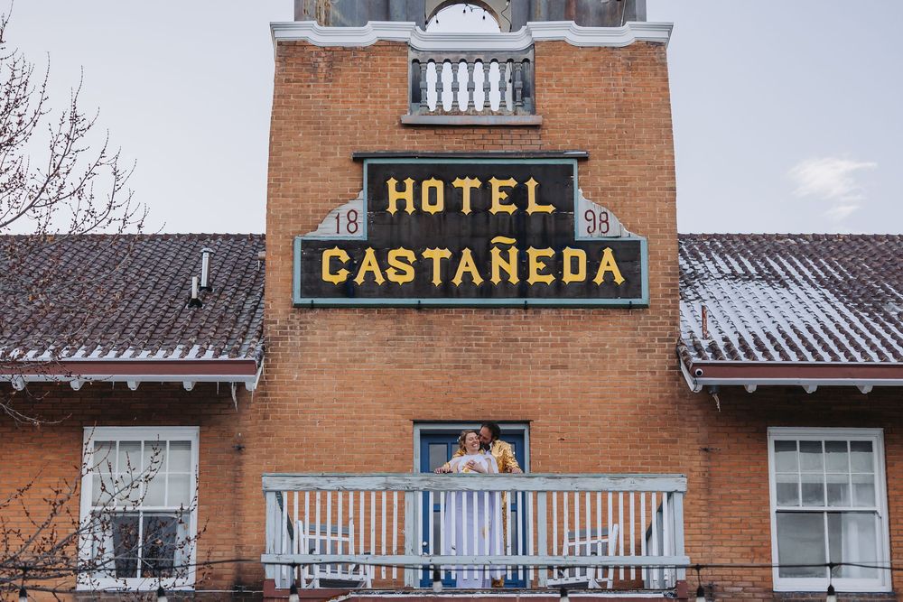 Historic Hotel Castaneda building with vintage signage and Spanish colonial revival architecture in Las Vegas, New Mexico.