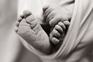 newborn photographer capturing feet details during studio session christchurch