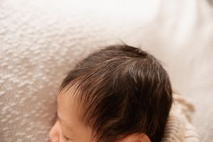detail shot of newborn hair during in home session in christchurch