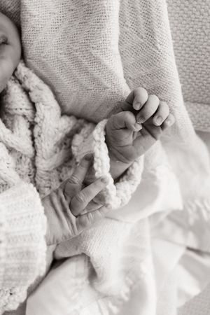 detail shot of hands during studio newborn studio session in bishopdale christchurch