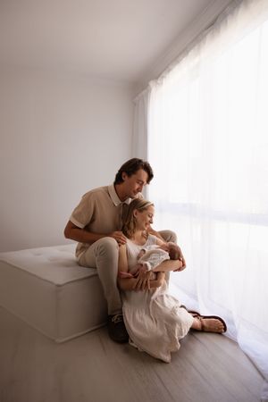 First time parents admiring their baby during studio newborn session in Bishopdale